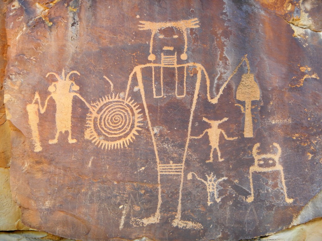 McKee Springs Petroglyphs. Some are quite large and can be seen from the road. But we climbed just as far to visit with them as the other site.
